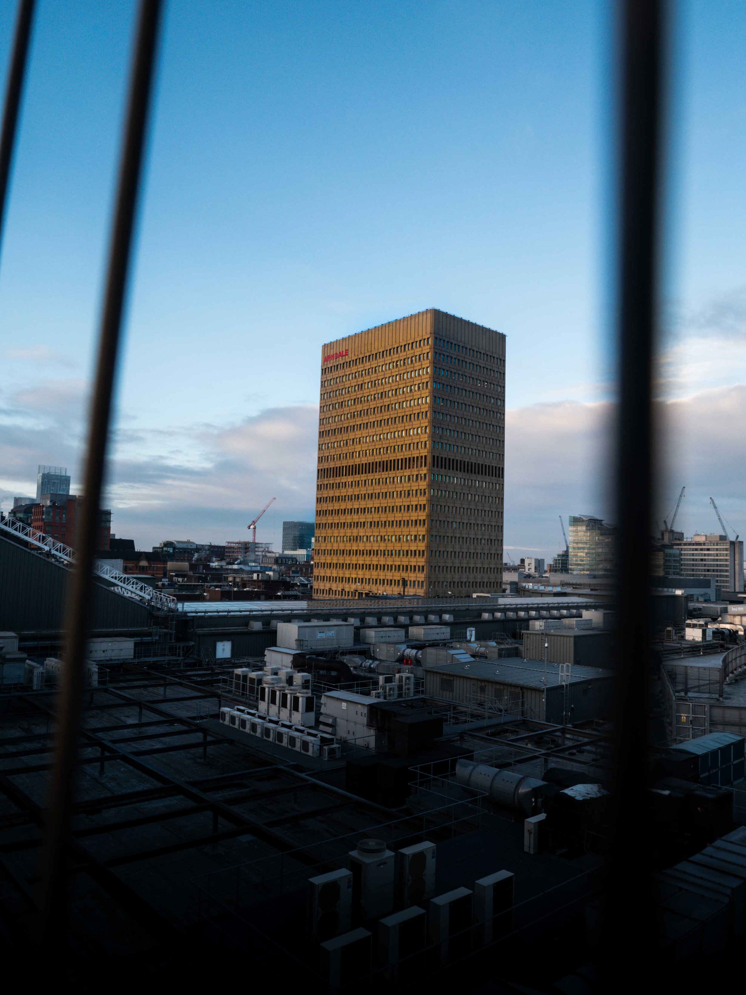 The Arndale building in Manchester with the sun shining on it.jpg