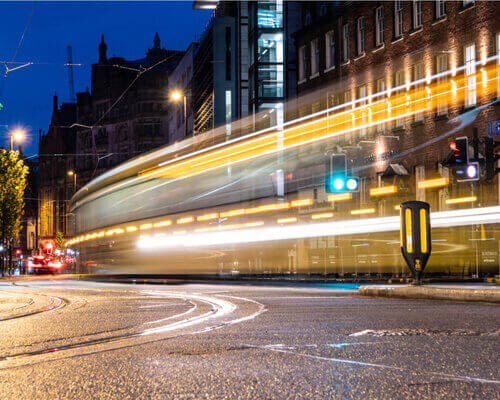 Slow shutter photography in Manchester City centre showing a Metrolink tram