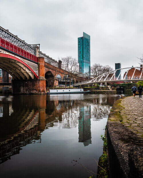Castlefield canal showing Beetham tower and historic architecture
