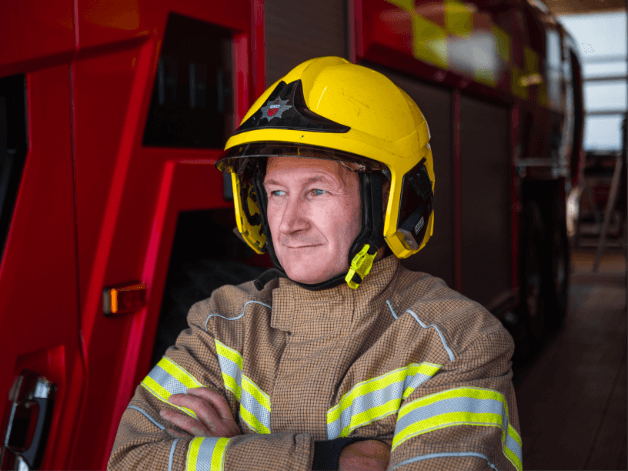 Portrait photography of a airport firefighter at Stansted wearing his full uniform