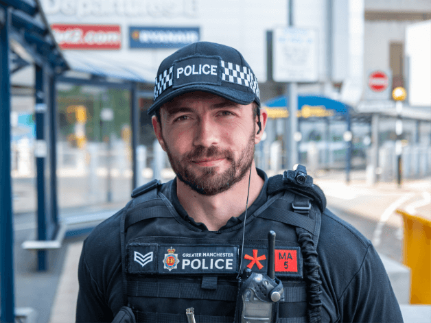 Headshot of an on duty police officer captured outside of Manchester Airport