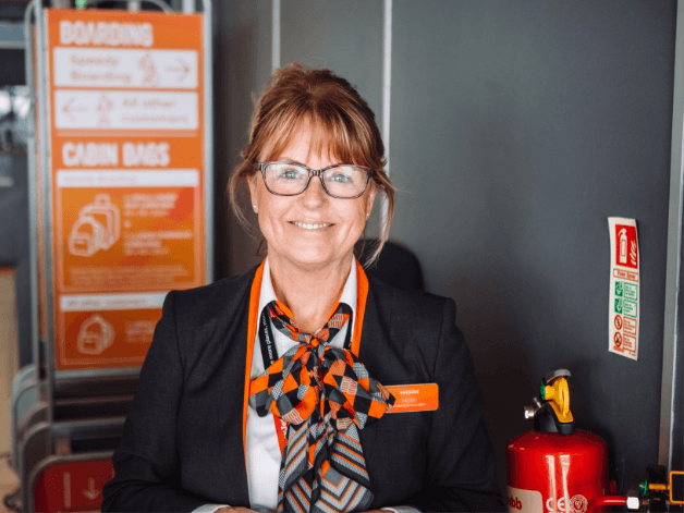 Happy young Easy Jet flight attendant captured as part of Manchester Airport’s Return to Travel campaign 