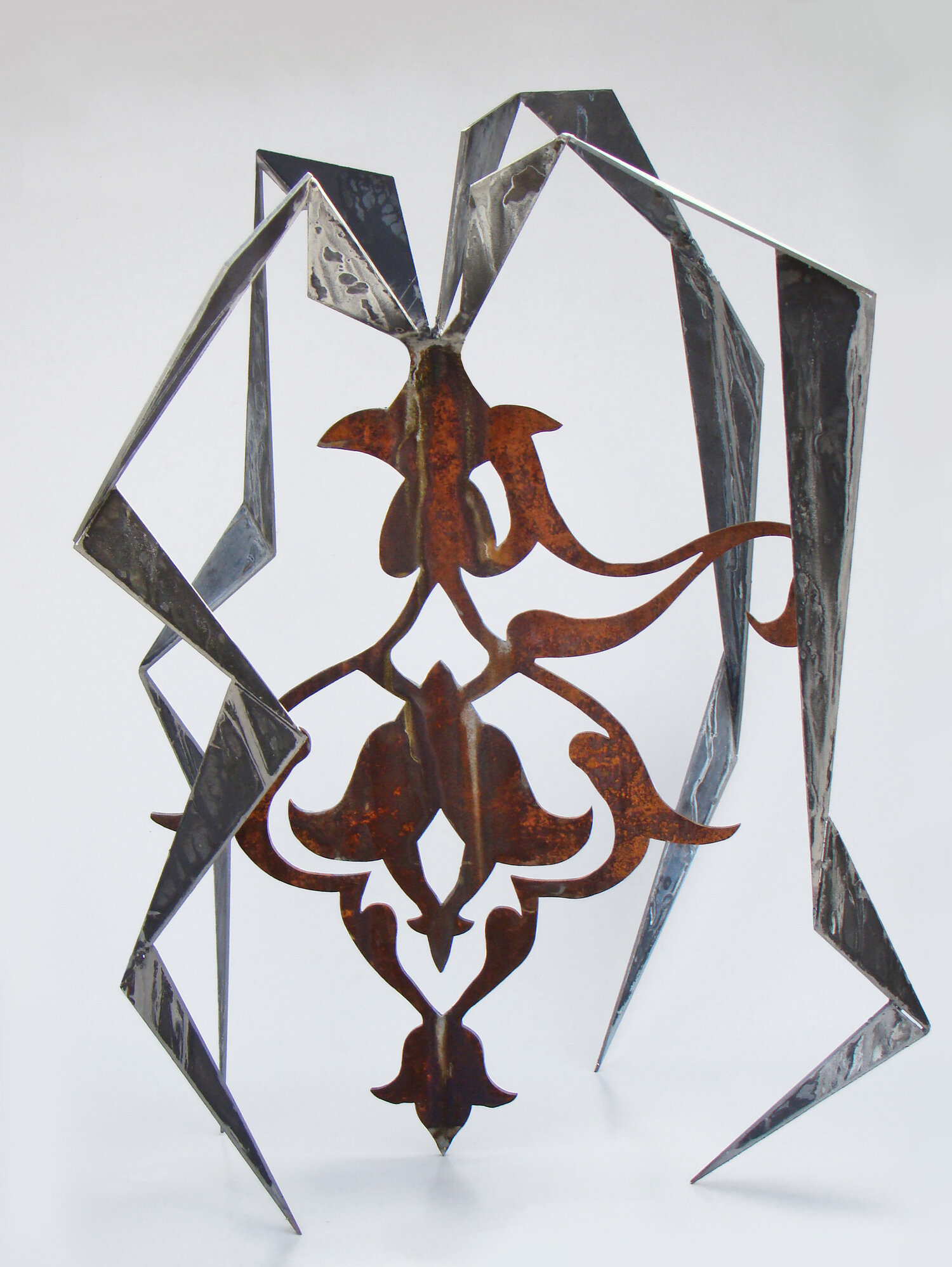    Metamorphosis  #7 .  Steel  .  10.5’ x 10.9’ x 18’ 