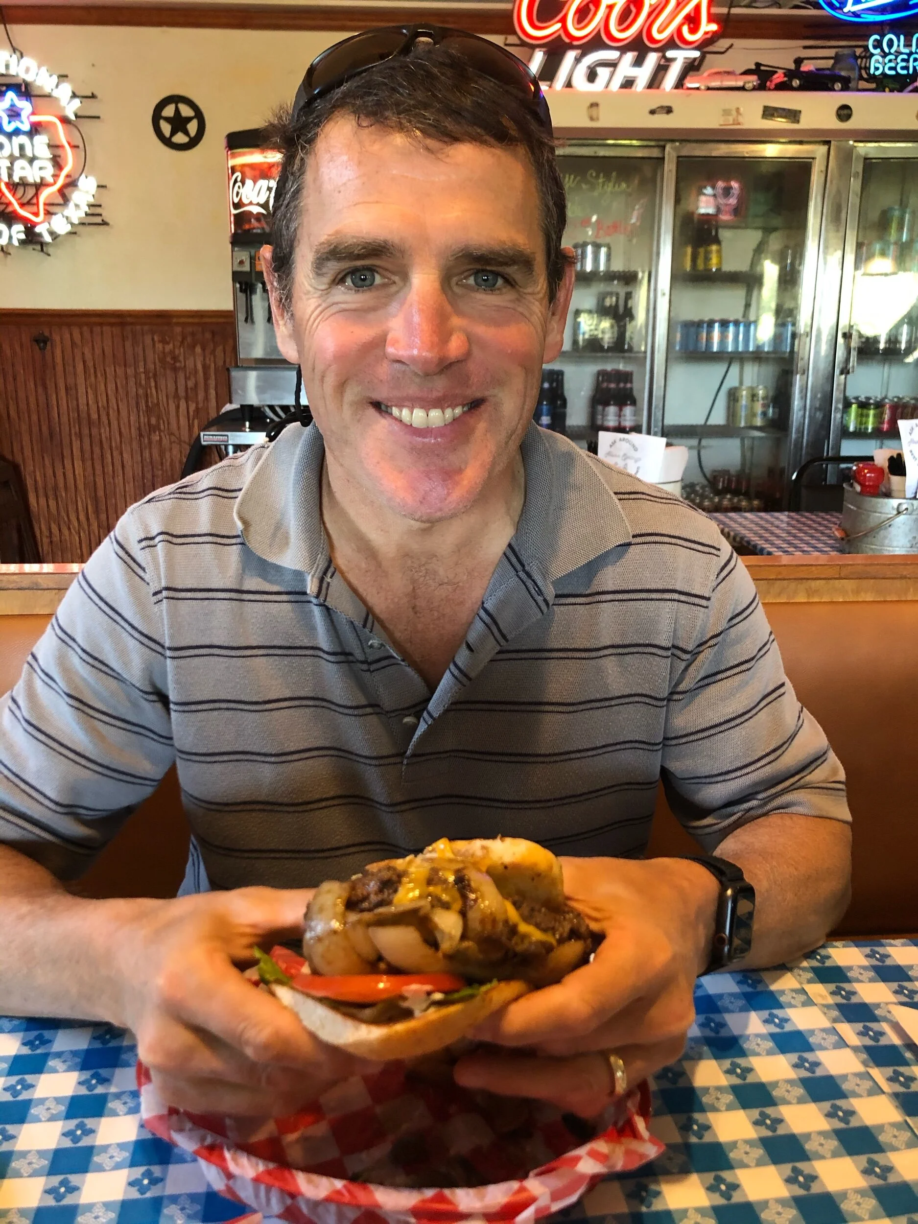 Ross digging into his burger at Alamo Springs.