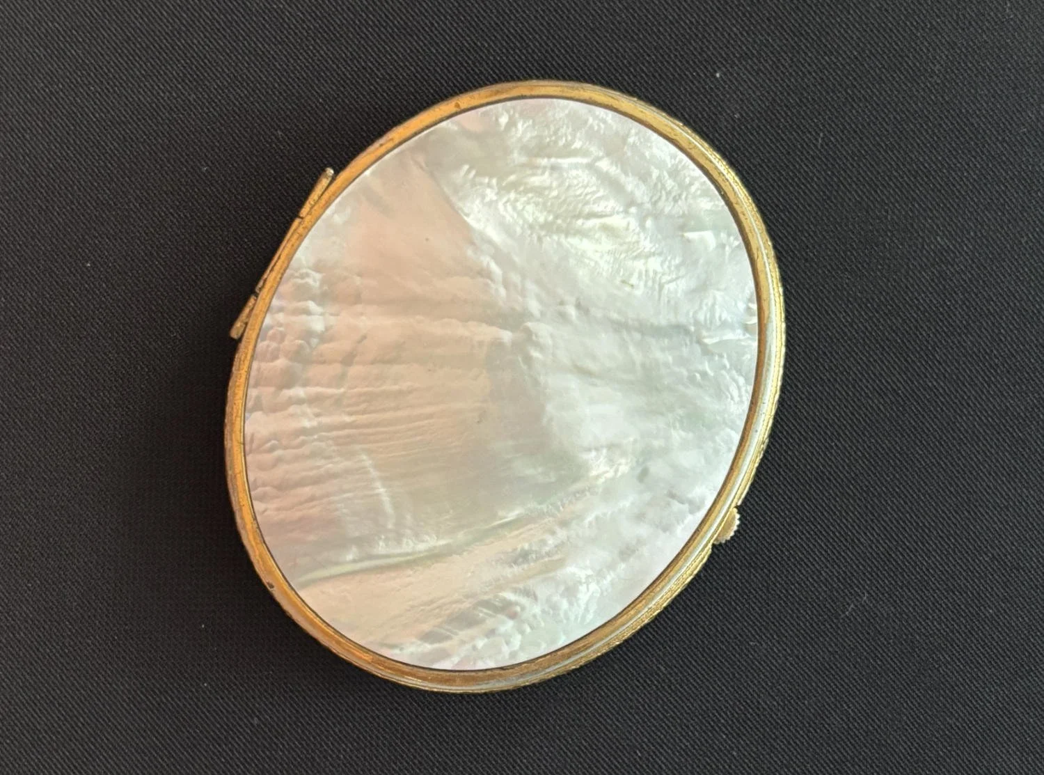 Mother of pearl snap case. Source unknown. PRI Education Collection 