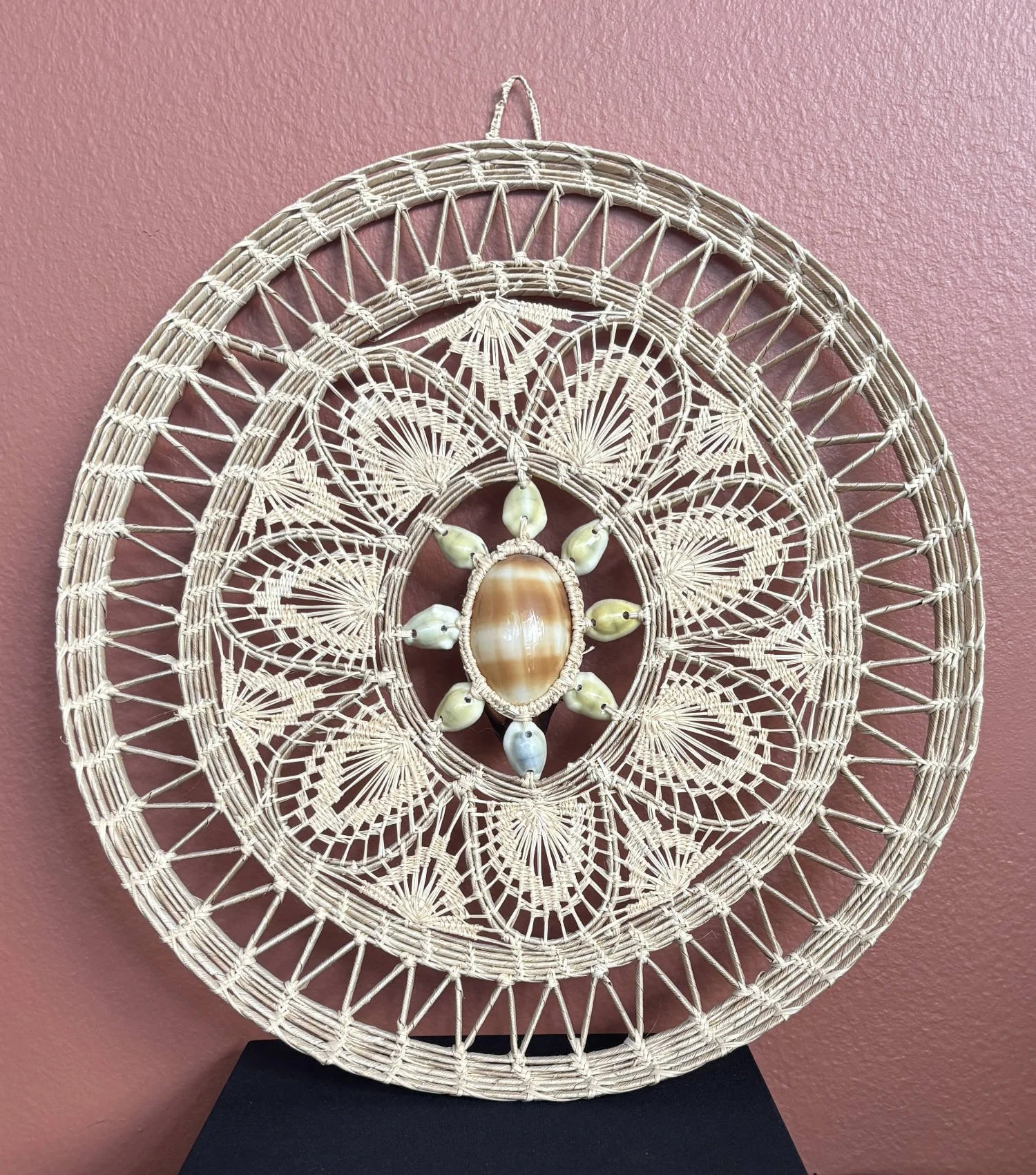 Wall hanging with cowrie shells. Marshall Islands. On loan from Rebecca Rundell. 