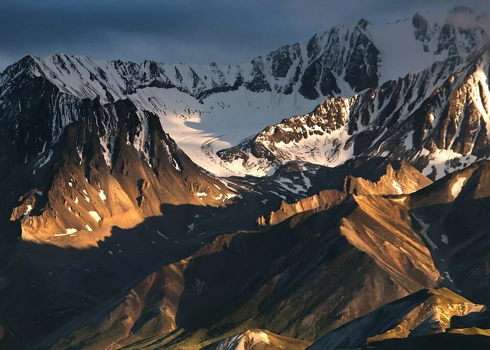 CIRQUE GLACIERS form in bowl-shaped depressions on mountainsides.