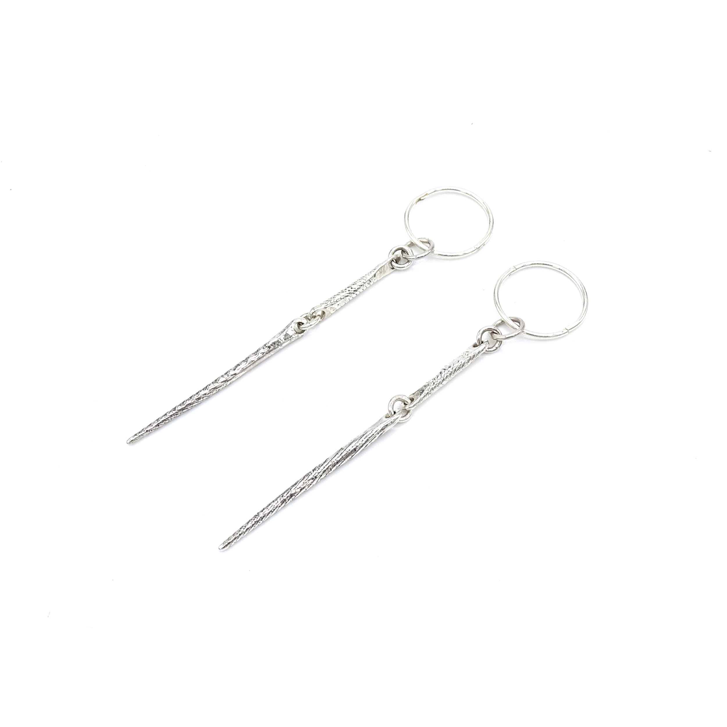 bone needle earring full angle.png