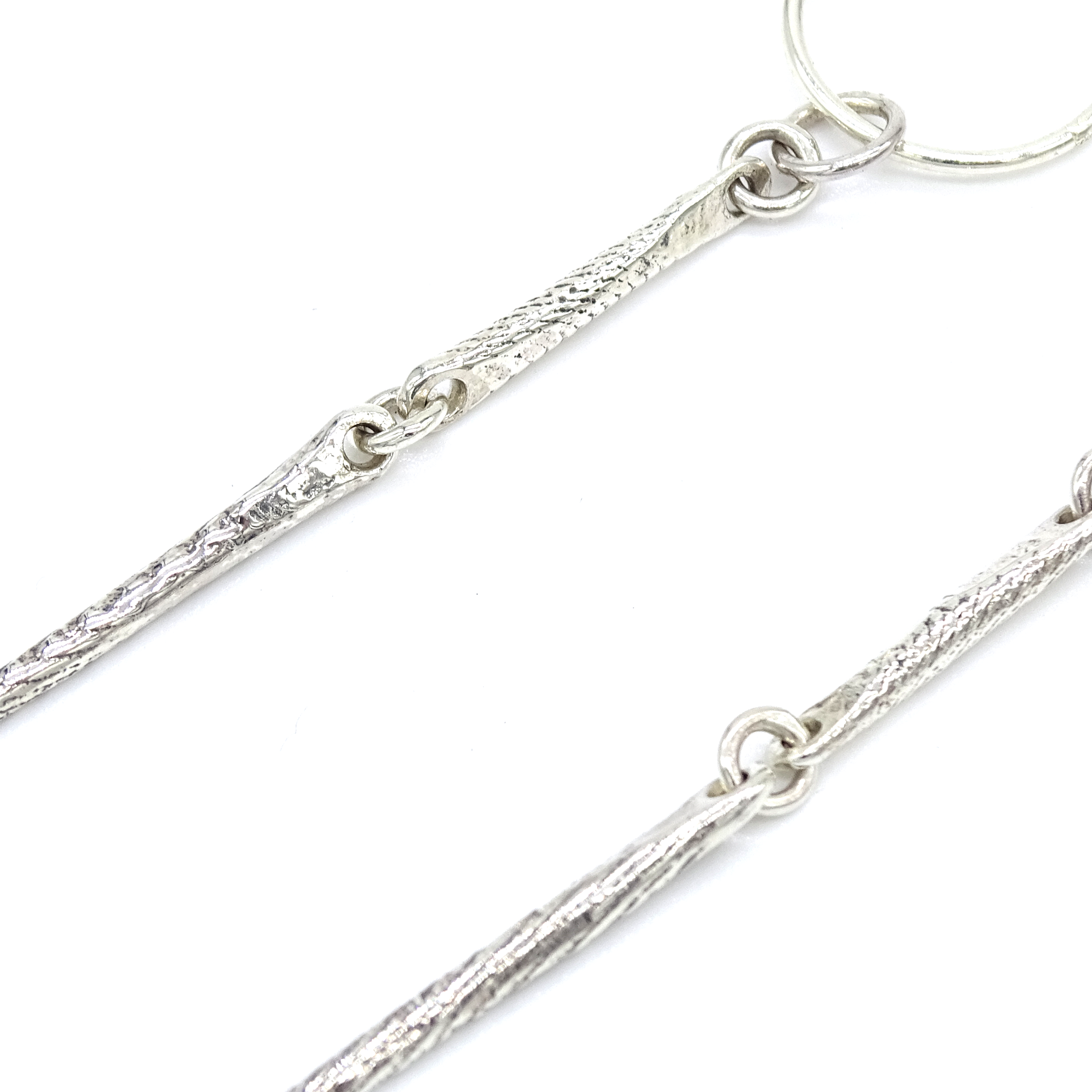 bone needle earring detail 2.png