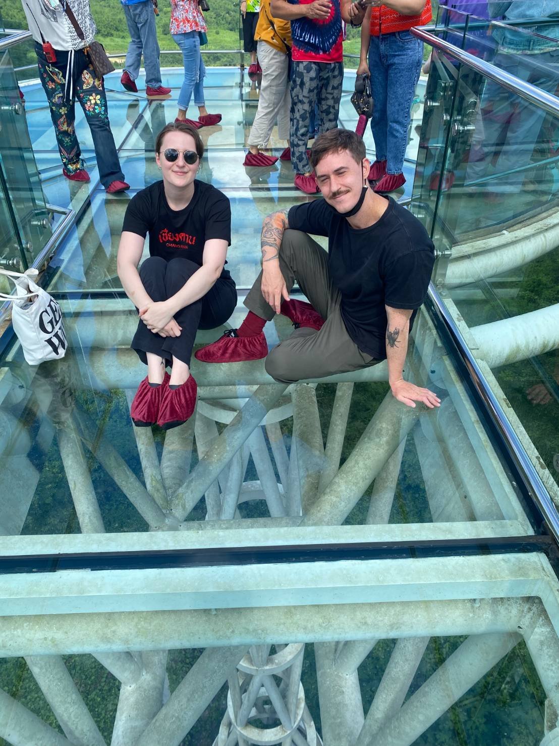 James and Amy sitting on the Chiang Khan Skywalk.jpg