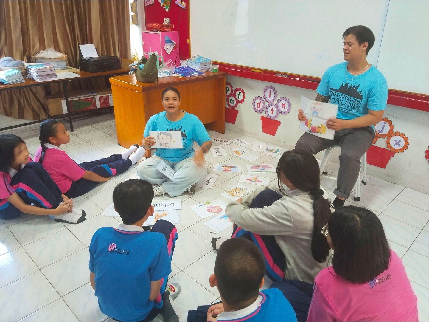 Word-guessing chaos just became the happiest game in school! 

Teacher Jason and Teacher Requal stood at the front, flashcards flying&mdash;one quick flash of a picture and suddenly twenty little voices were shouting &ldquo;Apple!&rdquo; &ldquo;Dog!&