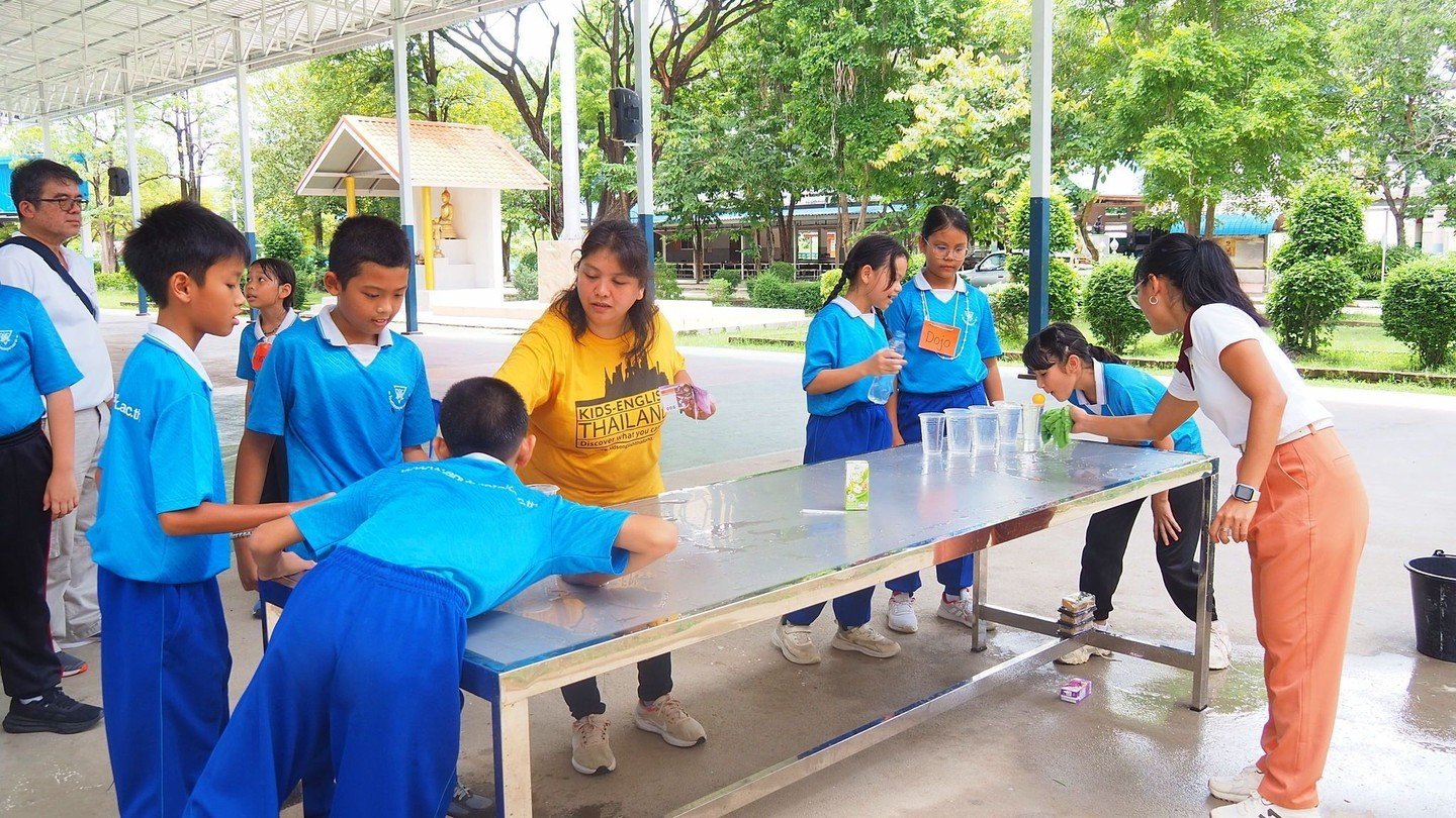 Science station just became the coolest floating race ever! 

Teacher Lexi lined up cups of water, dropped a ping-pong ball on the very first one, and suddenly every kid was on their knees, cheeks puffed, blowing like little hurricanes to make the ba