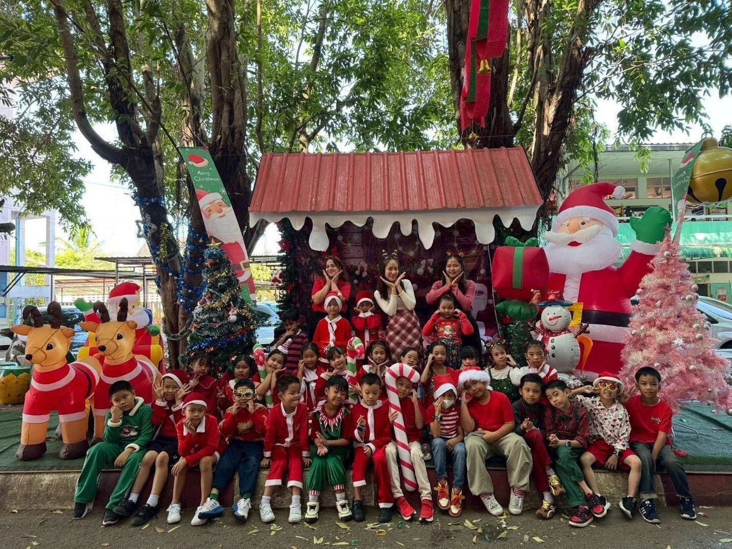 Pure Christmas magic at school! 

Teacher Mya and our wonderful little elves created the most adorable holiday scene ever &ndash; surrounded by giant Santa, reindeer, snowmen, candy canes, and that super cute Christmas hut!  The kids in their festive