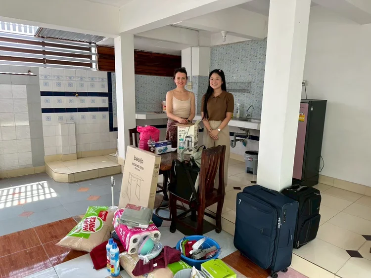 KET staff helping a teacher move into an apartment in Thailand