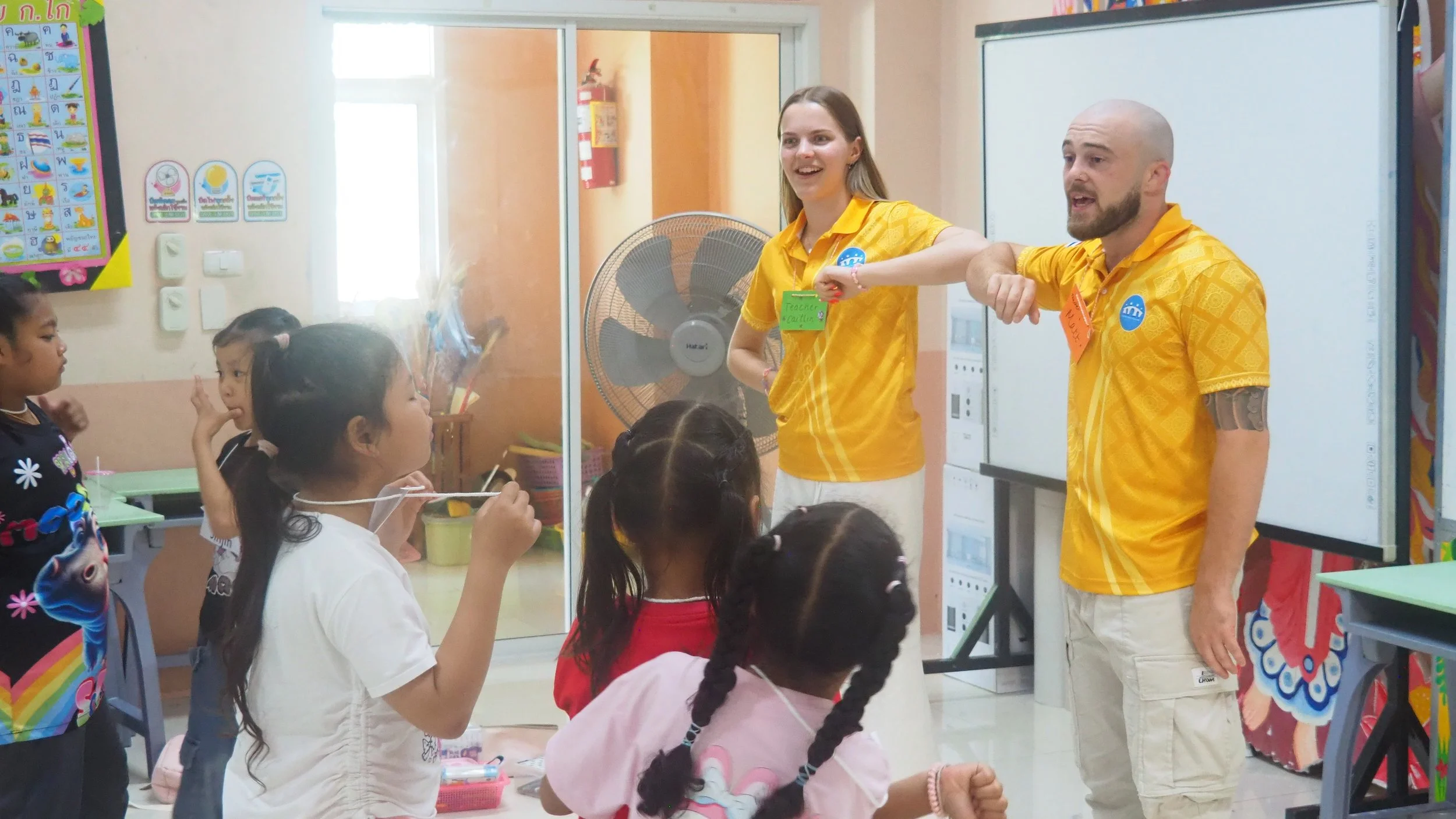 KET teacher using body language and games to engage Thai students in English class