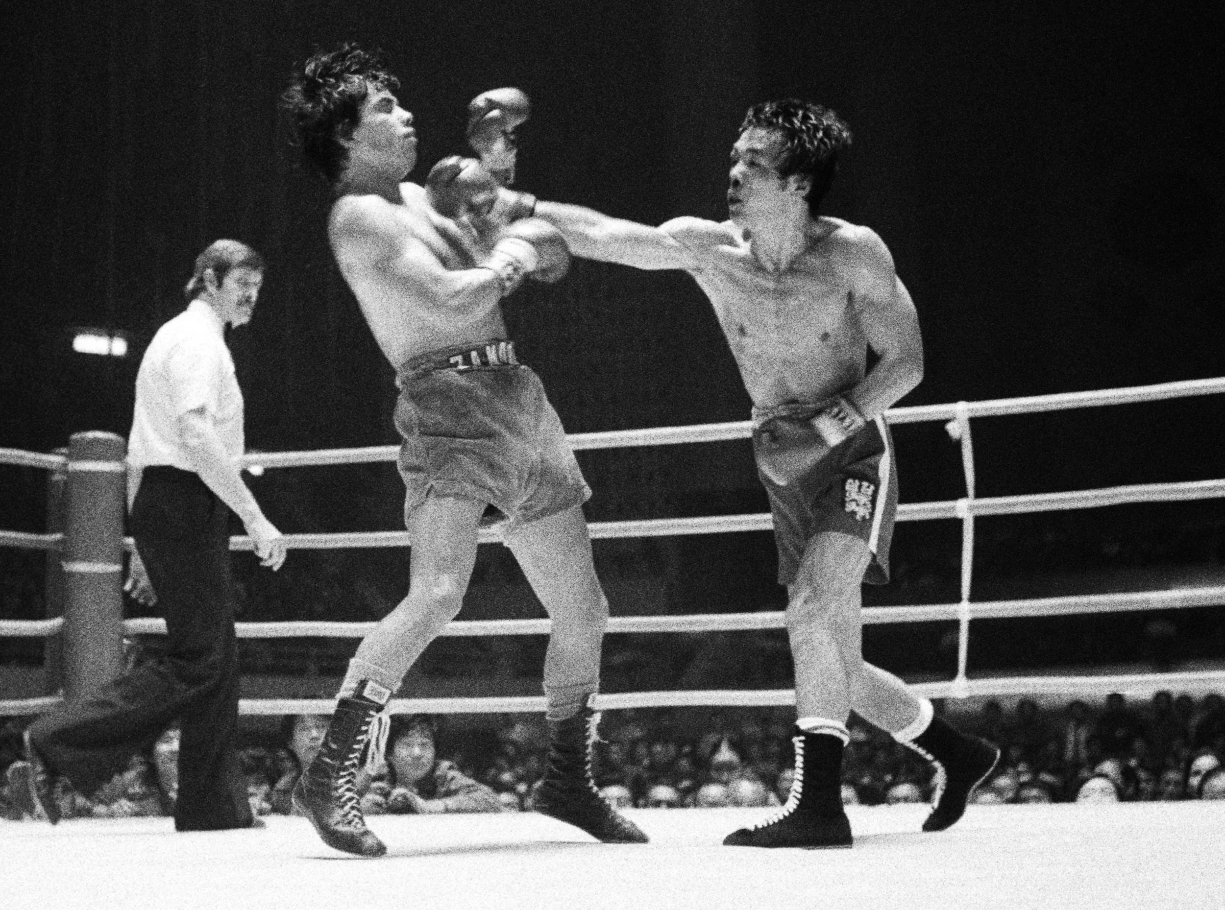 Alfonso Zamora takes a right hand from Soo-Hwan Hong, his toughest challenger prior to Zarate