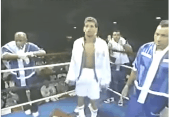 Arturo getting announced, under the cheers of the Jersey crowd, with that classic white and blue Robe. Pat Lynch behind him.