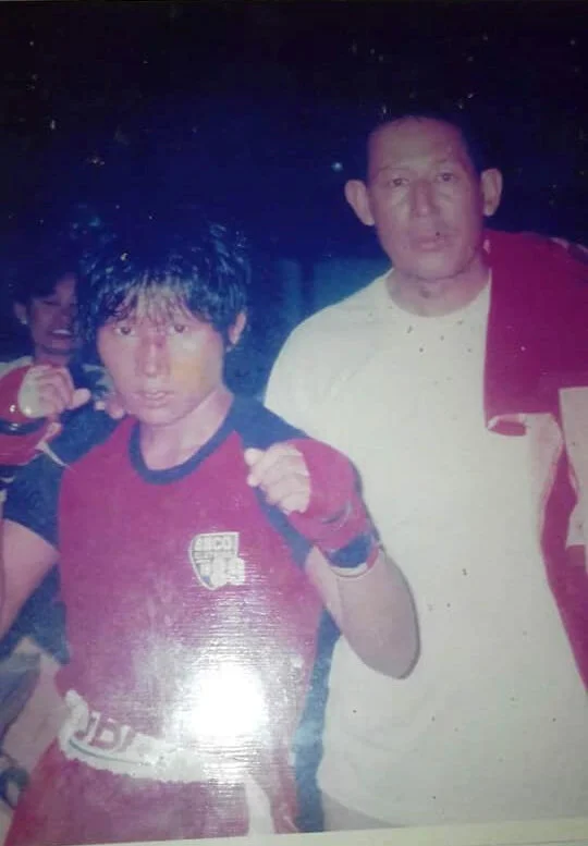 Kyu Kyu Thin, a successful boxer active 25 years ago. Seen here with coach Patma Sein.