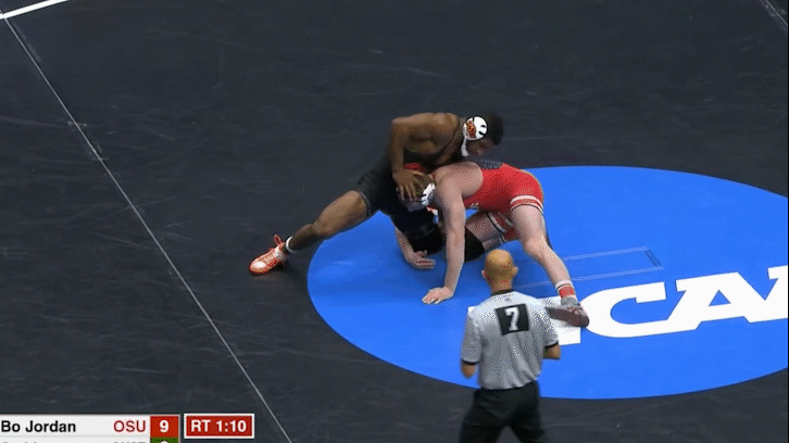 Bo Jordan executing a back trip off the outside Armpit Lock. For a clean finish, Bo sweeps the opponent’s post foot out while in midair.