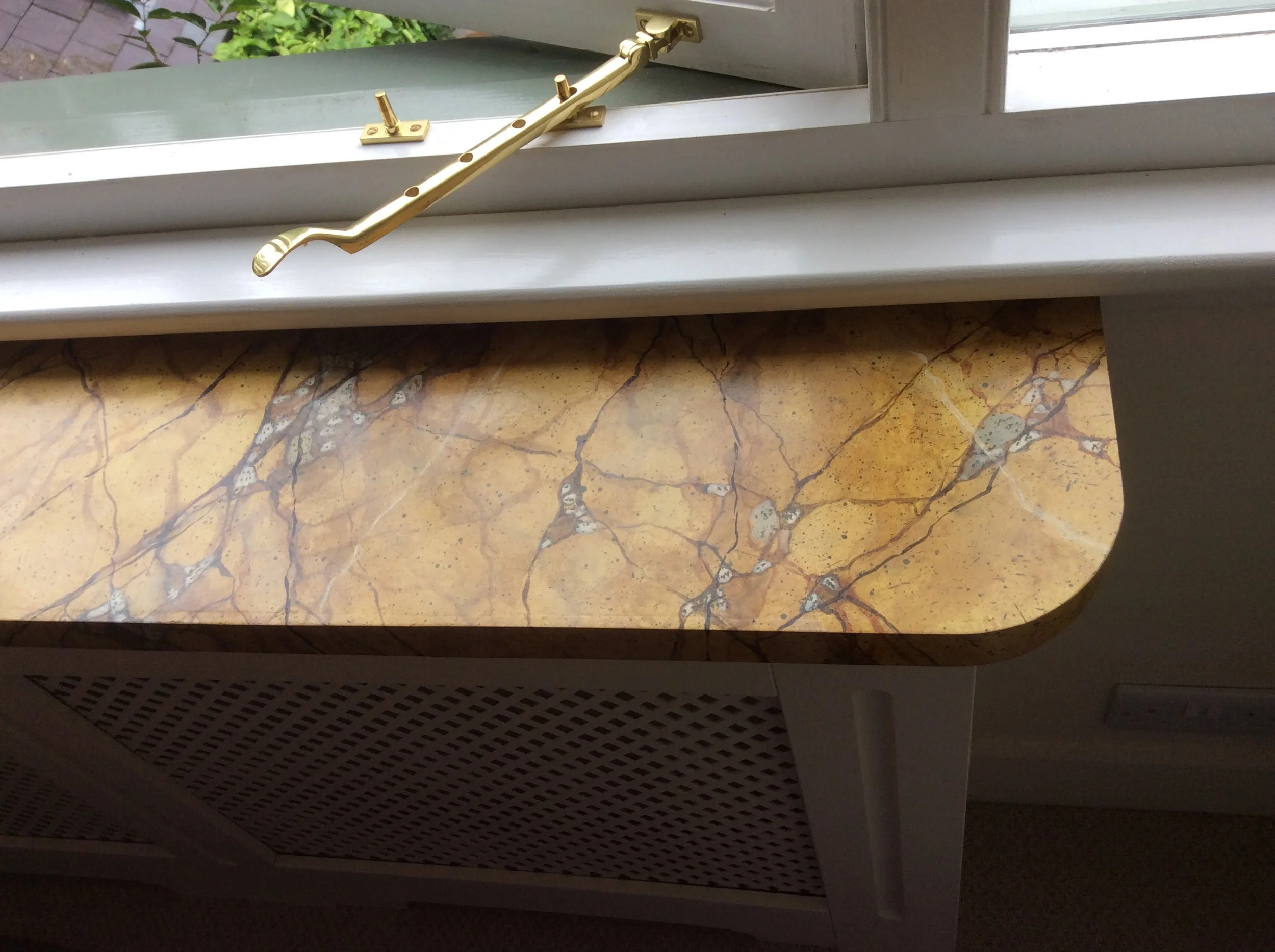 Marbled top to radiator-cover and corner wall shelf. 