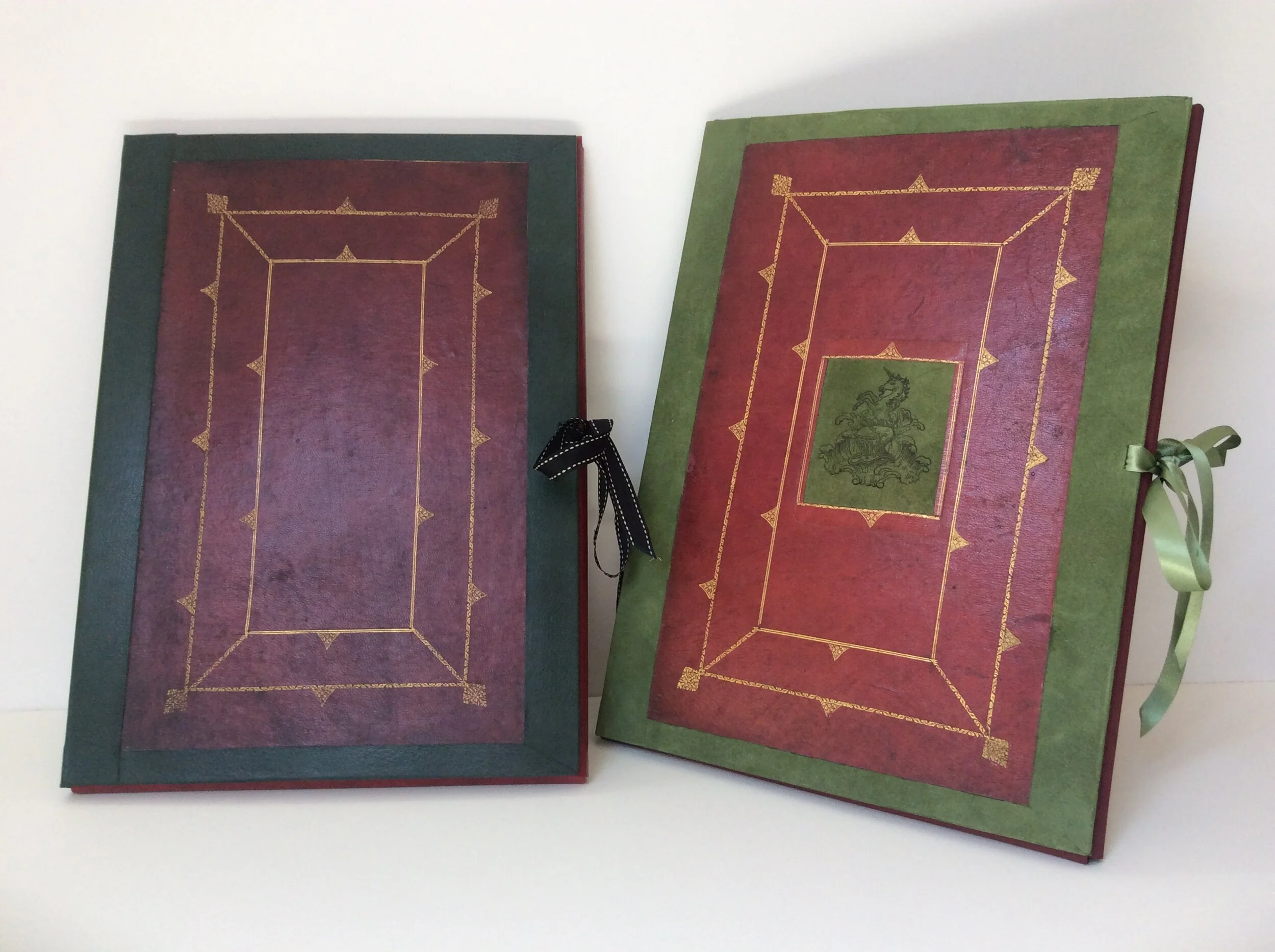  Hard-back folio cases for storing artwork and documents. 