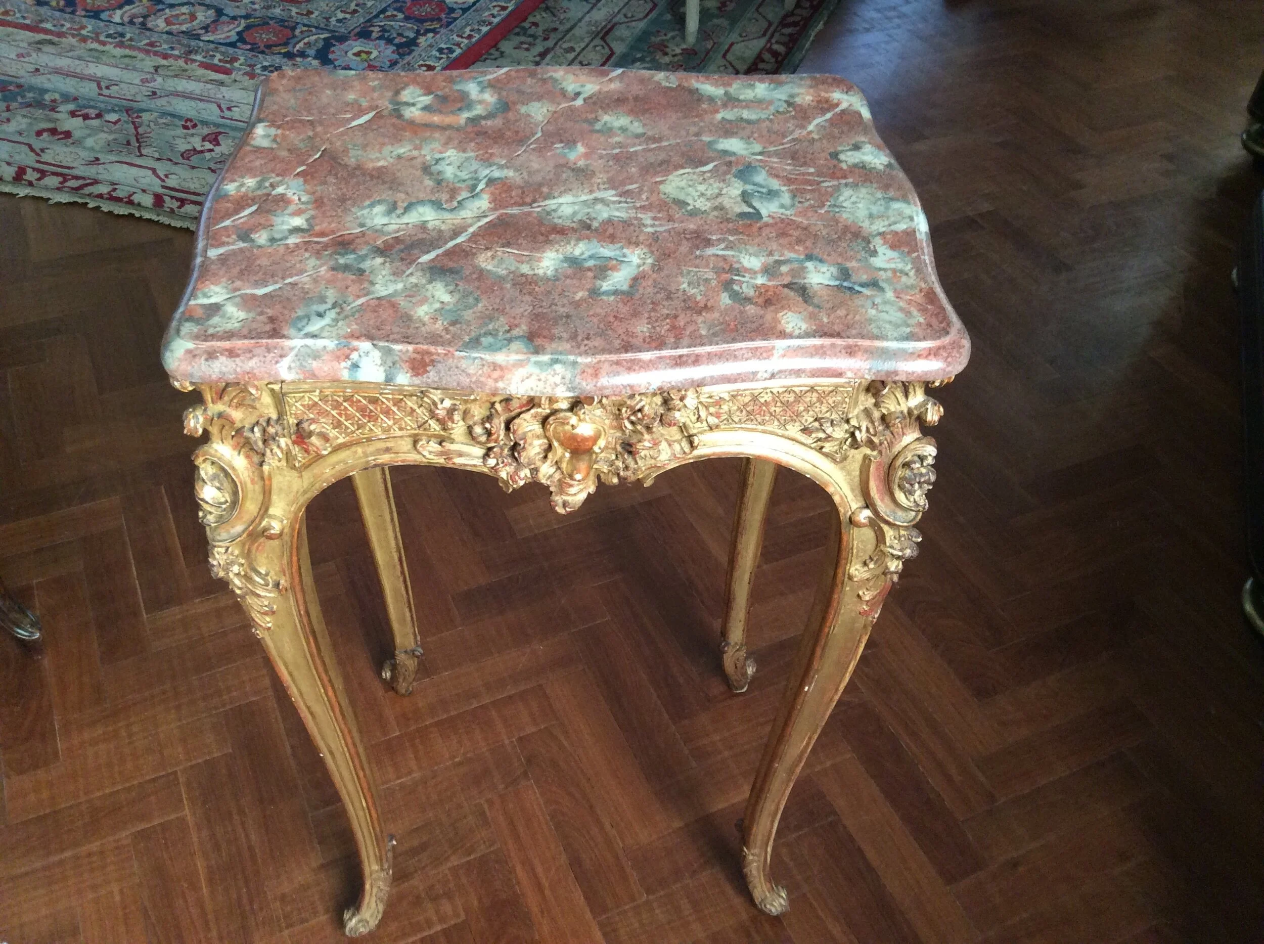  Small side-table with wood top, painted as “Rouge-Royale” marble. 
