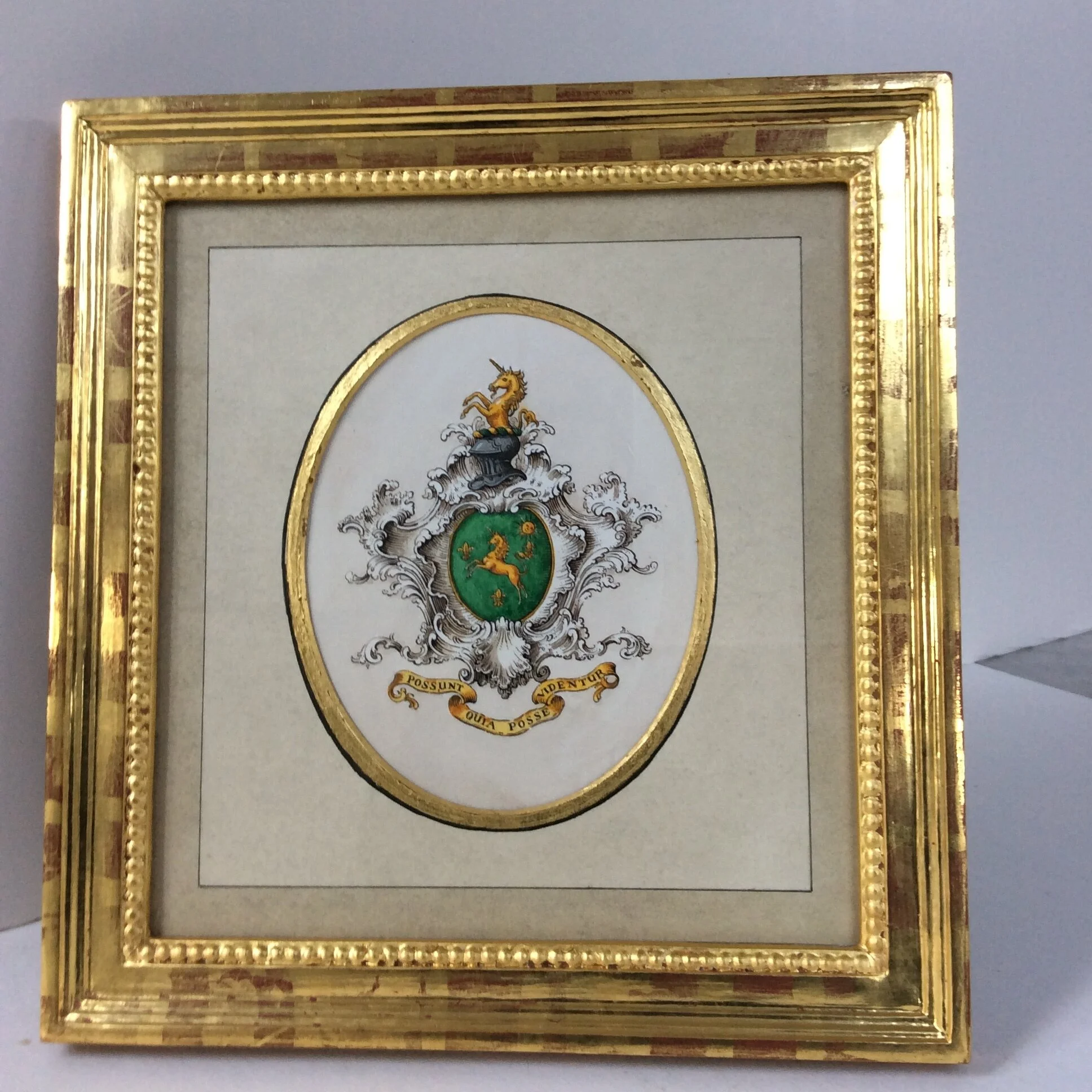  Water-gilded Frame. Coat of Arms in water-colour-wash oval Mount with gold-leaf on bevel. 