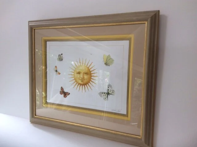  Wooden Frame, painted and stippled. Deep bevel Mount with folded coloured paper. 