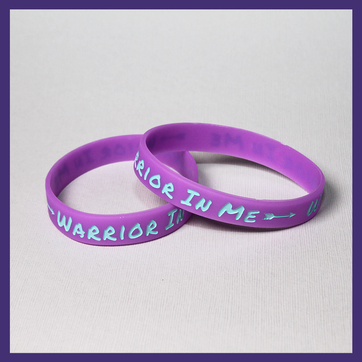 SET OF TWO PURPLE "WARRIOR IN ME" BRACELETS