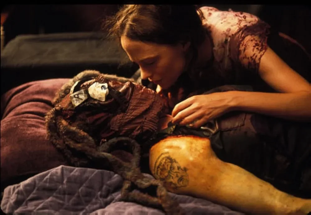 May leans over her creation, Amy, an amalgamation of dead body parts.