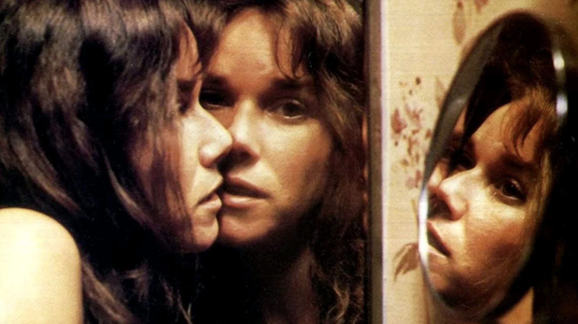 Carla is forced up against the bathroom mirror.