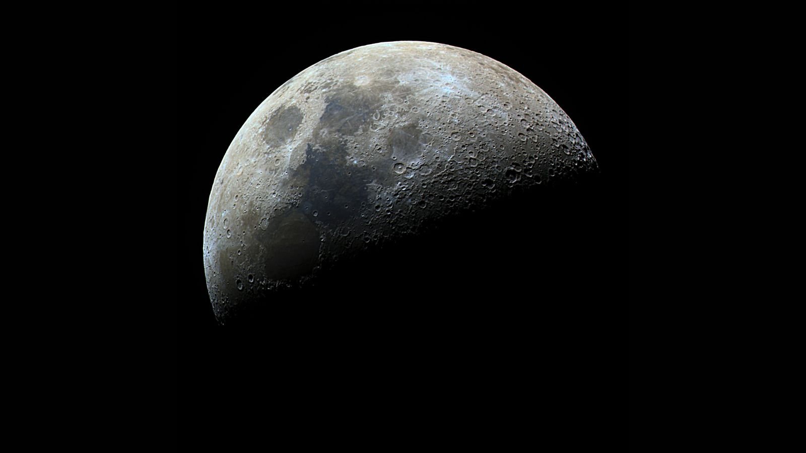 Image of the moon in half-shadow.