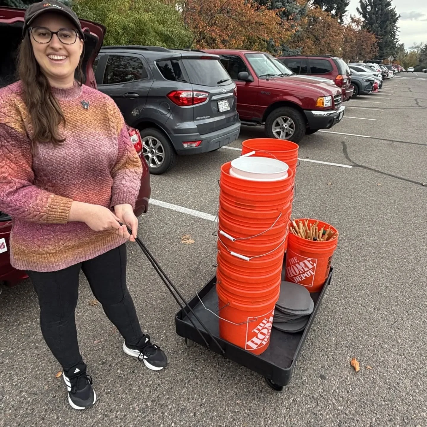 Cart that didn't have a rope finally has a rope, and with teamwork and organization skills it was very easy to come up with a new rope and me and my intern managed to get it to work! 

[Image description: Bonnie holding new rope on wagon with layer o
