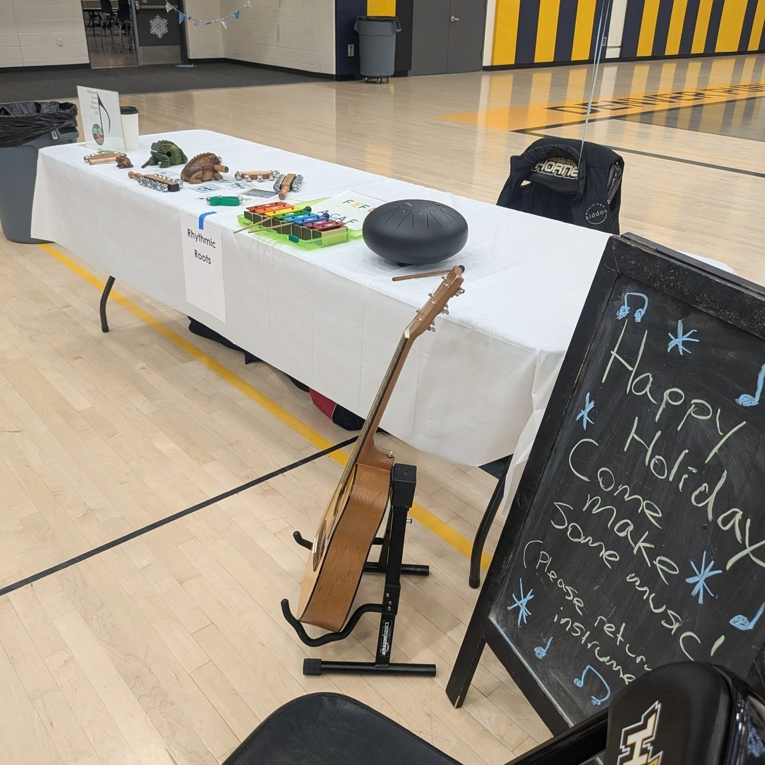 I had so much fun at DSST's Winter Carnival last week, making music with the students and staff. Dinger, Miles, and @movethroughyoga stopped by my table!

[Image description 1: Rhythmic Roots' table at the event filled with bells, wooden frogs, and t