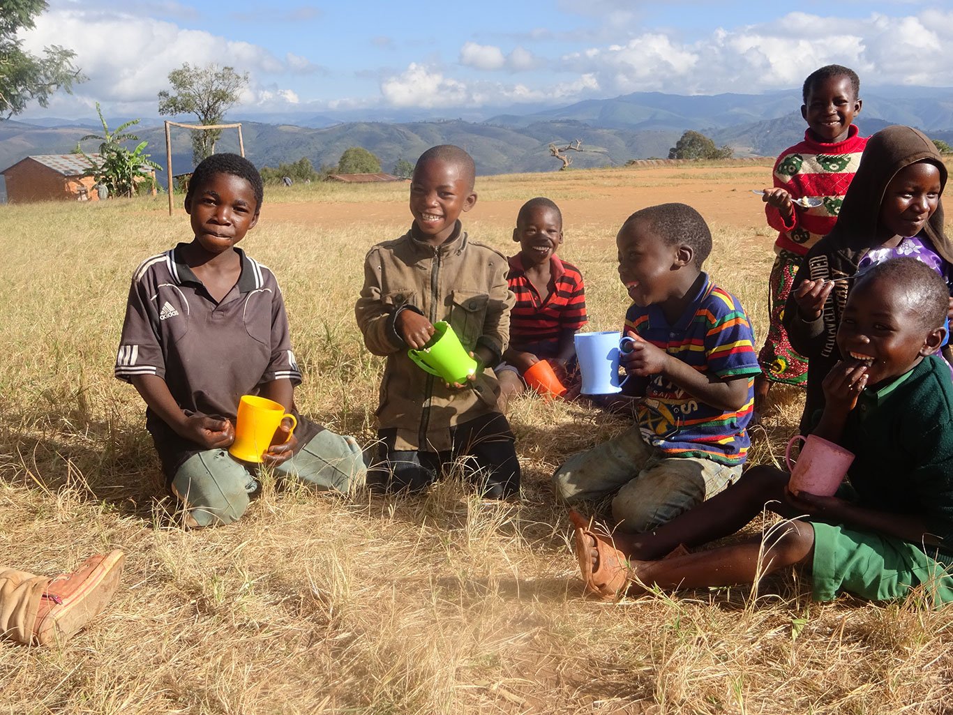 Tanzania_Global-Volunteers_Children-at-the-English-camp-having-RAH-meals_2019_01.jpg