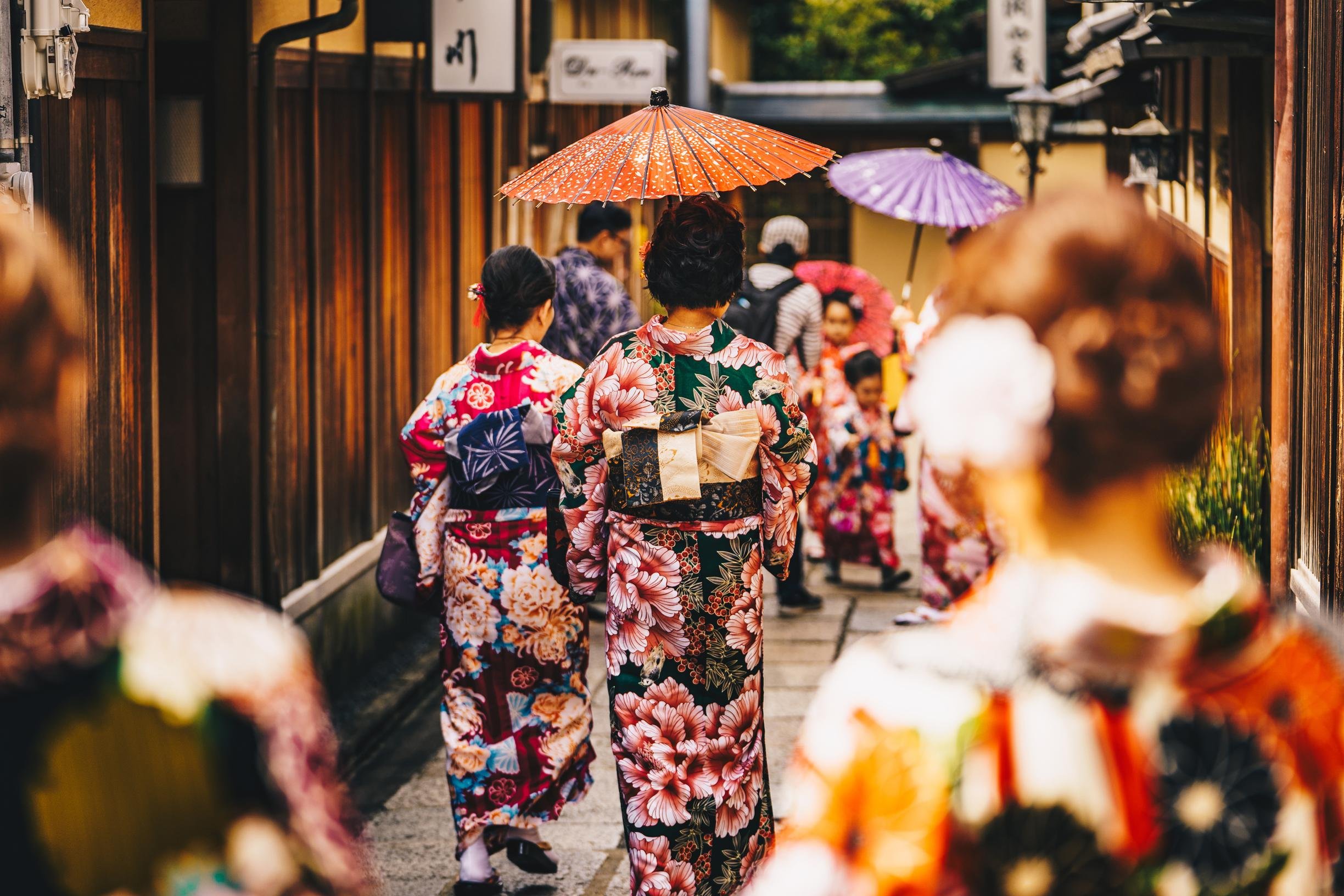 Women in traditional Japanese kimonos walking in Kyoto, Japan.
