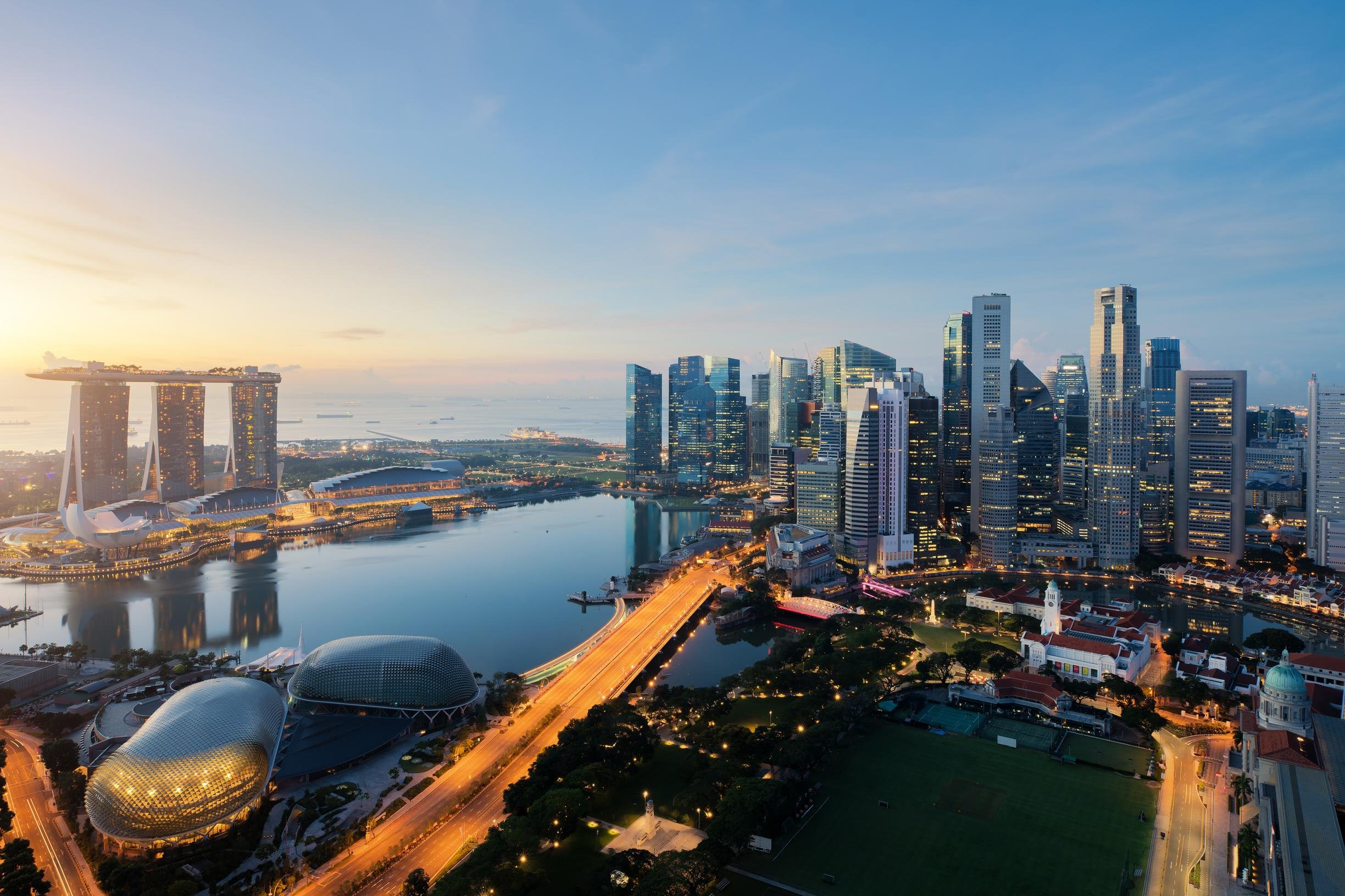 Aerial view of Singapore business district and city at twilight.