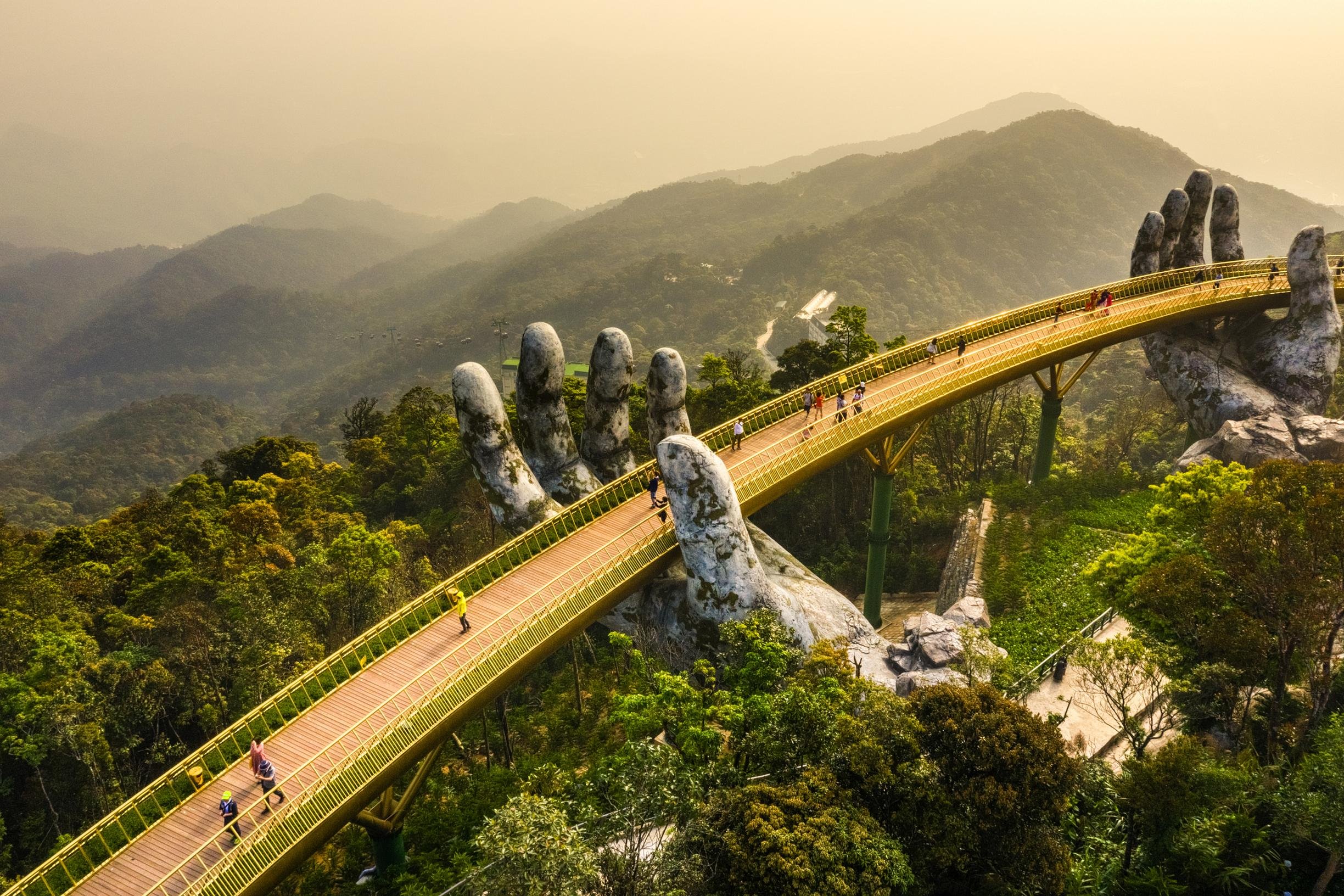 The famous Golden Bridge is lifted by two giant hands in the tourist resort on Ba Na Hill in Da Nang, Vietnam.