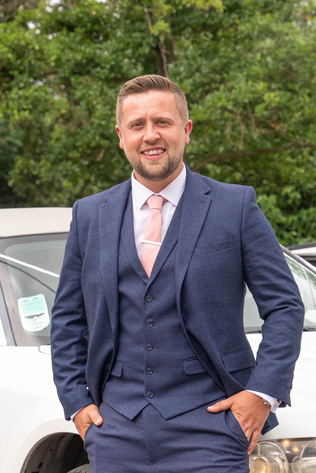 groom_on_wedding_car.jpg