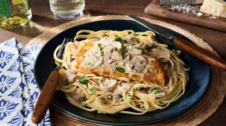 Chicken Scallopini with a Mushroom Wine Sauce on Linguine