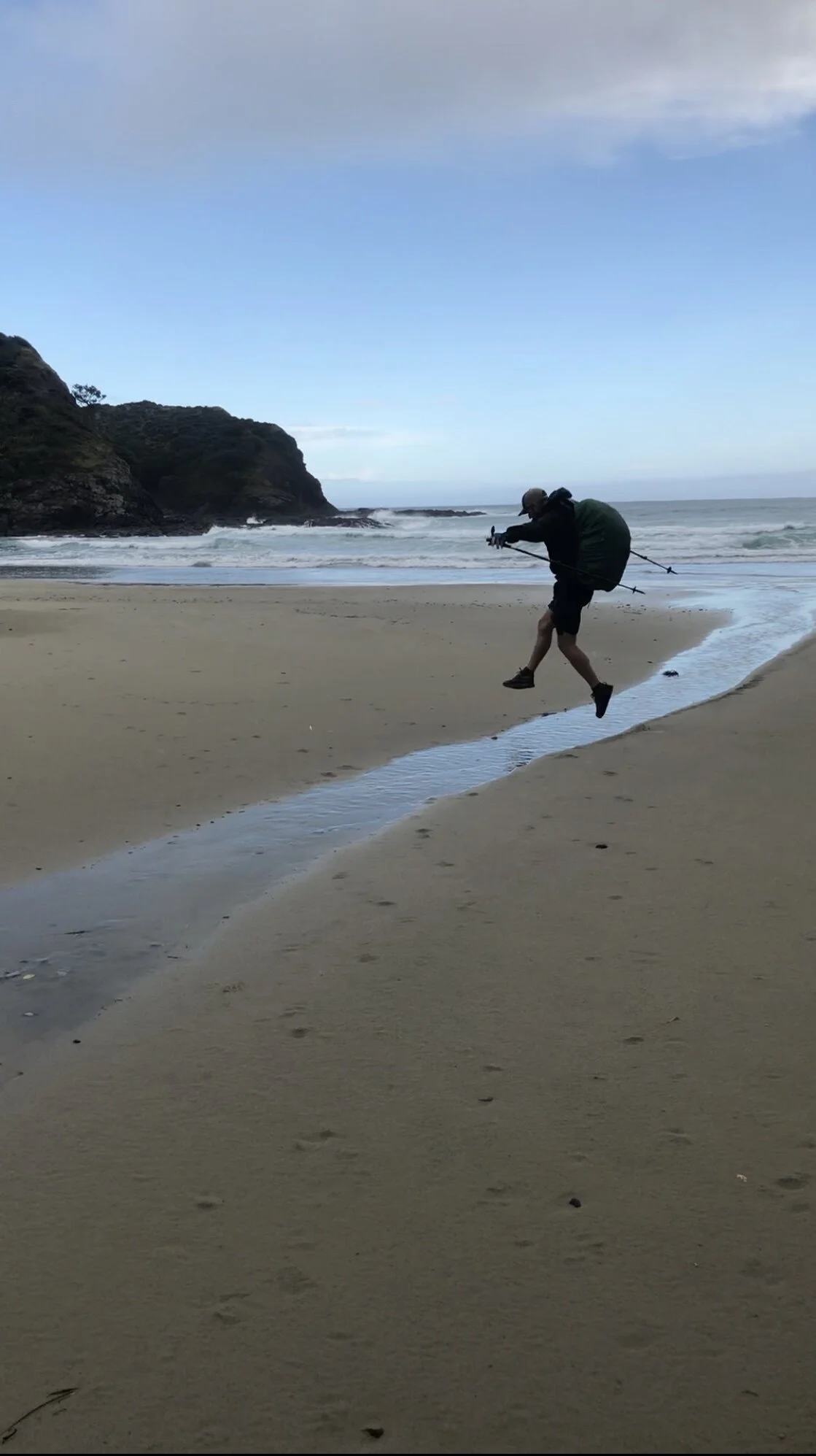 Alex jumping over the stream
