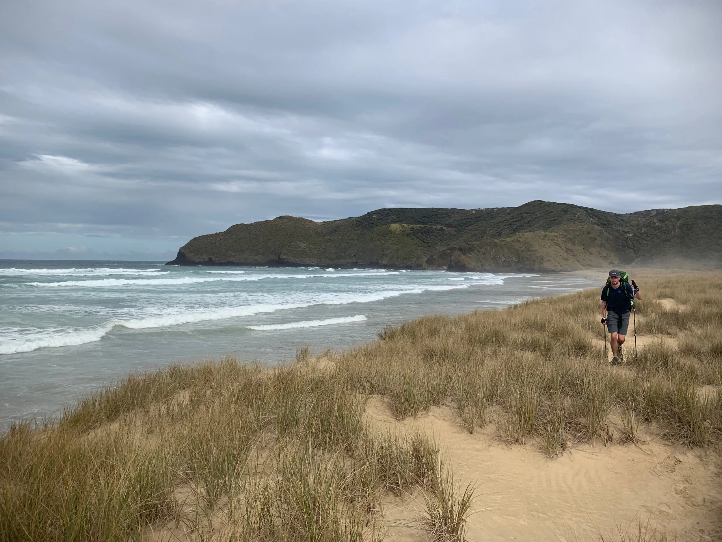 Ethan walking on top of the dunes.