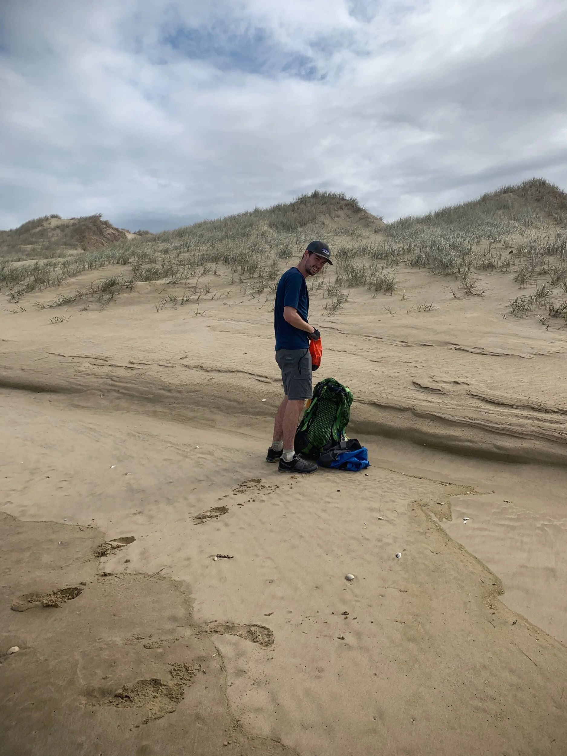 Ethan with his wet rain jacket on the ground.