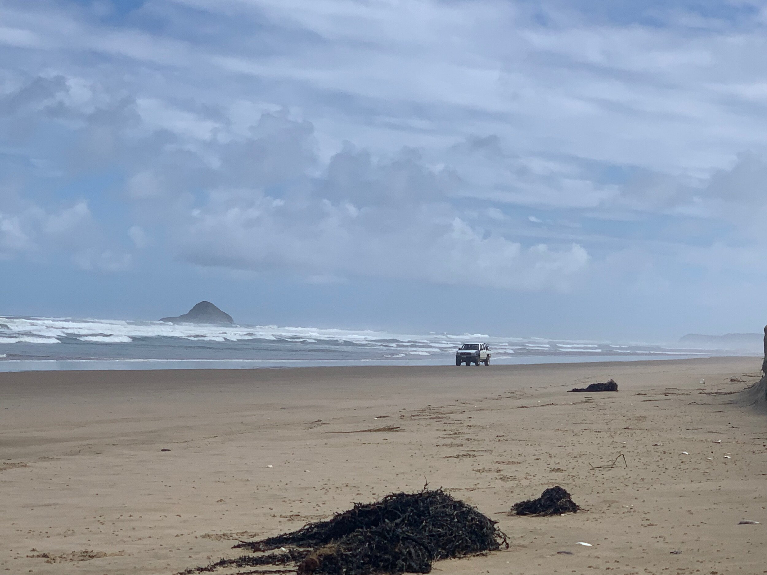 Car on the beach.
