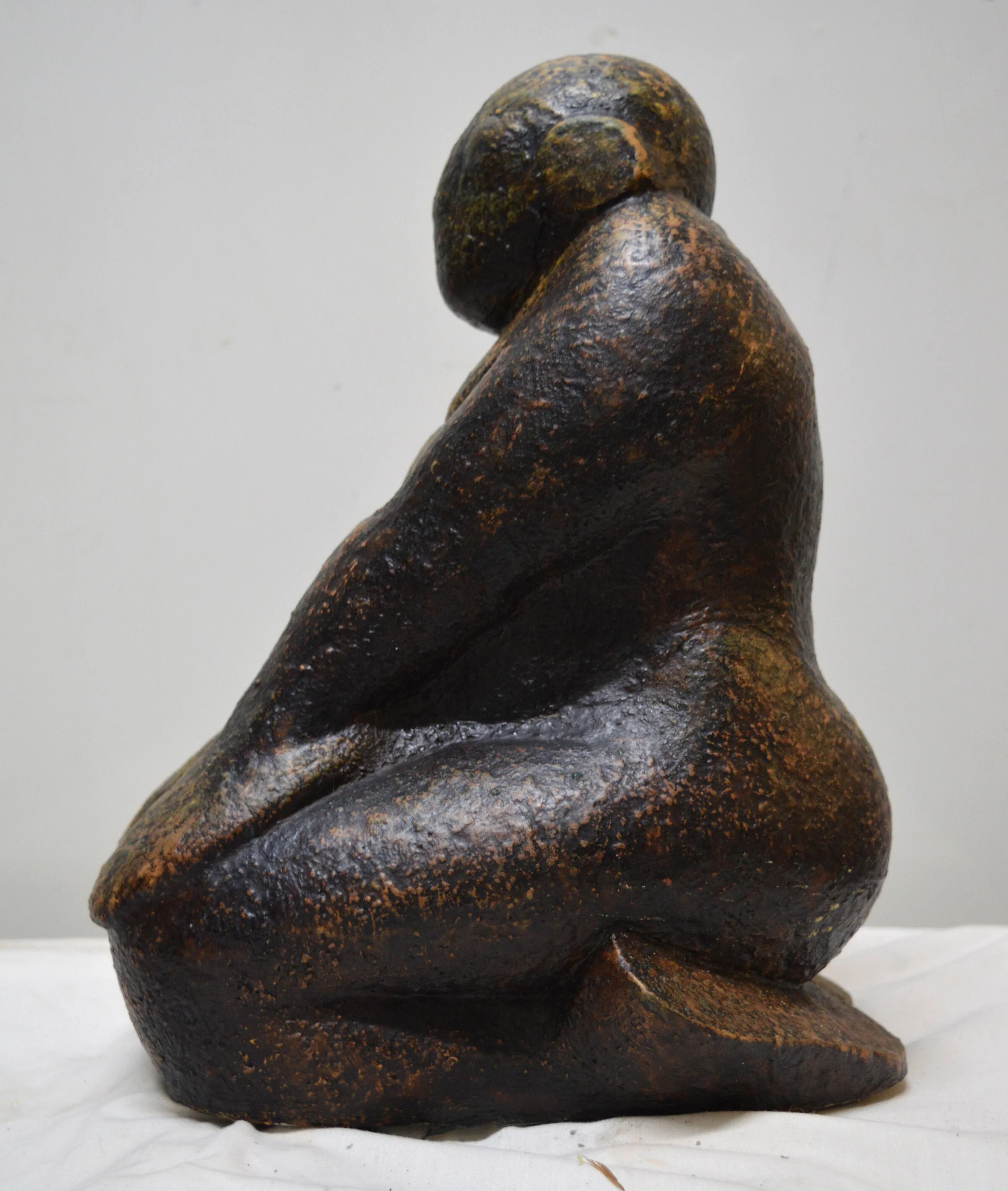 Dark kneeling figure