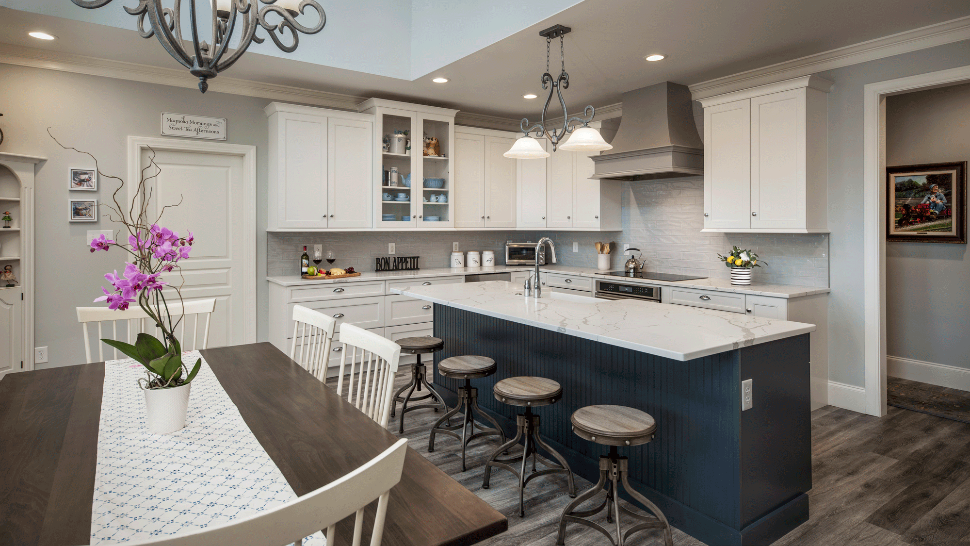 sleek kitchen remodel with flooring, cabinets, pendant lighting, recessed lighting, tile backsplash, island, seating