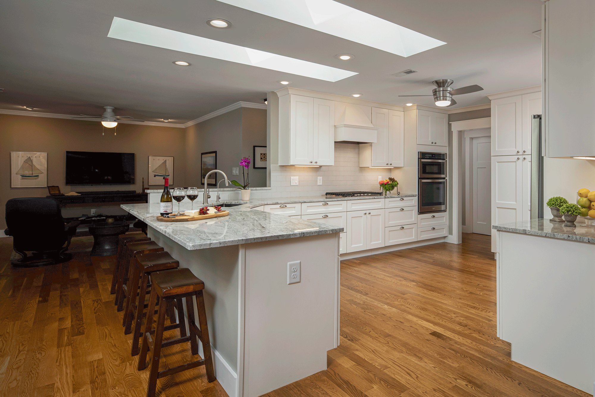 kitchen remodel with lighting, island, seating, and decor