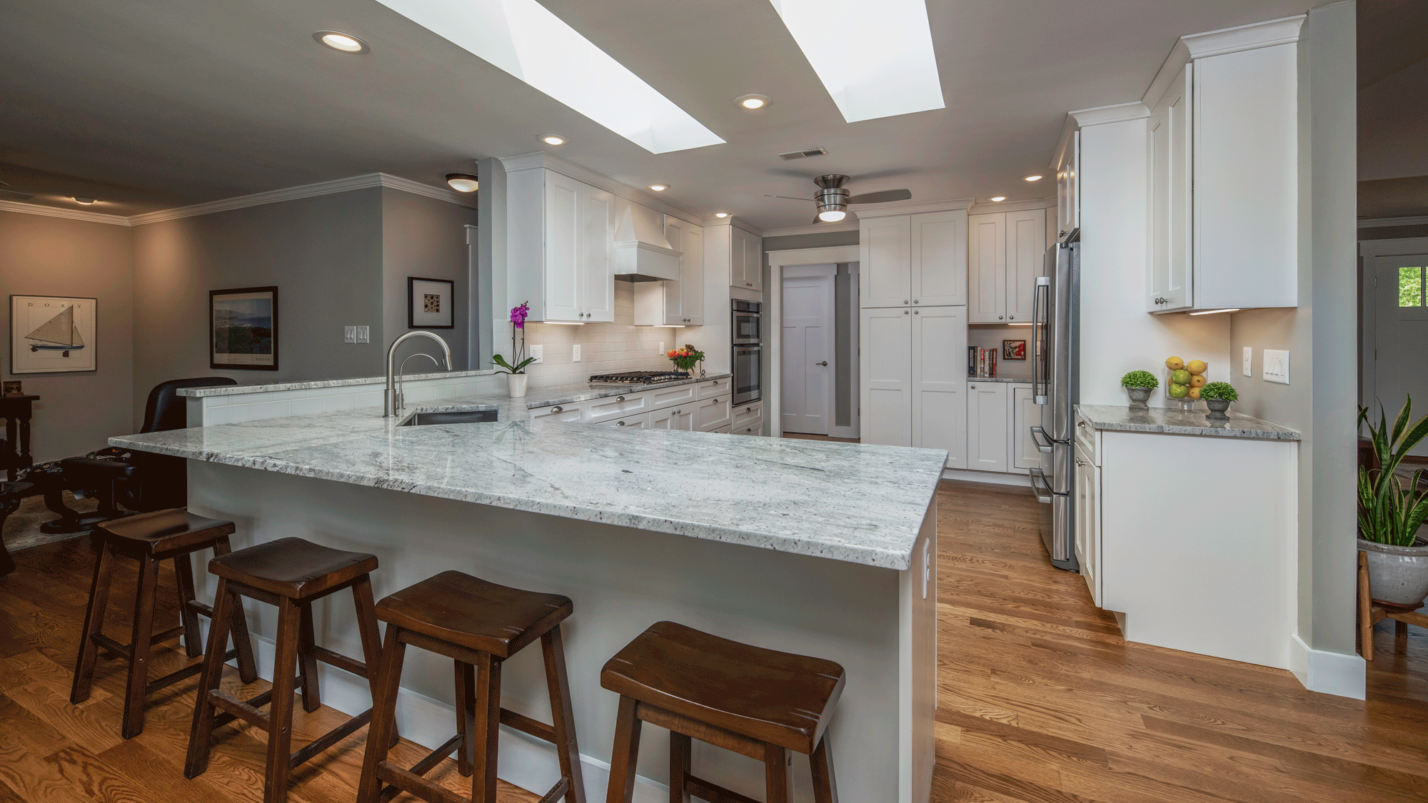 kitchen remodel with lighting, island, seating, and decor