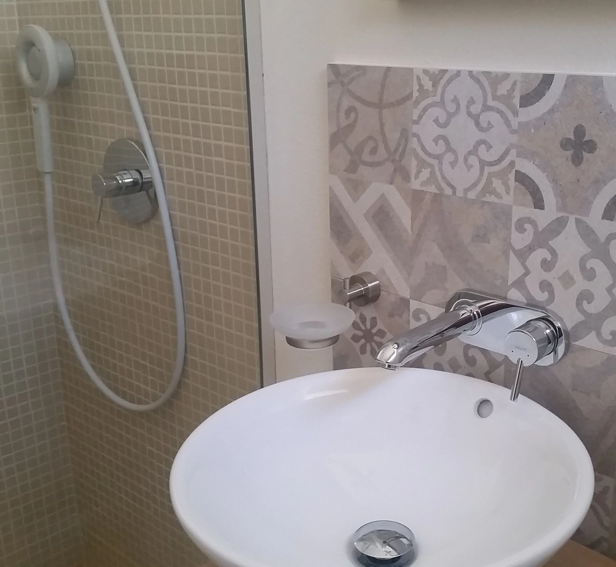 En suite shower room with water saving taps & nebia shower