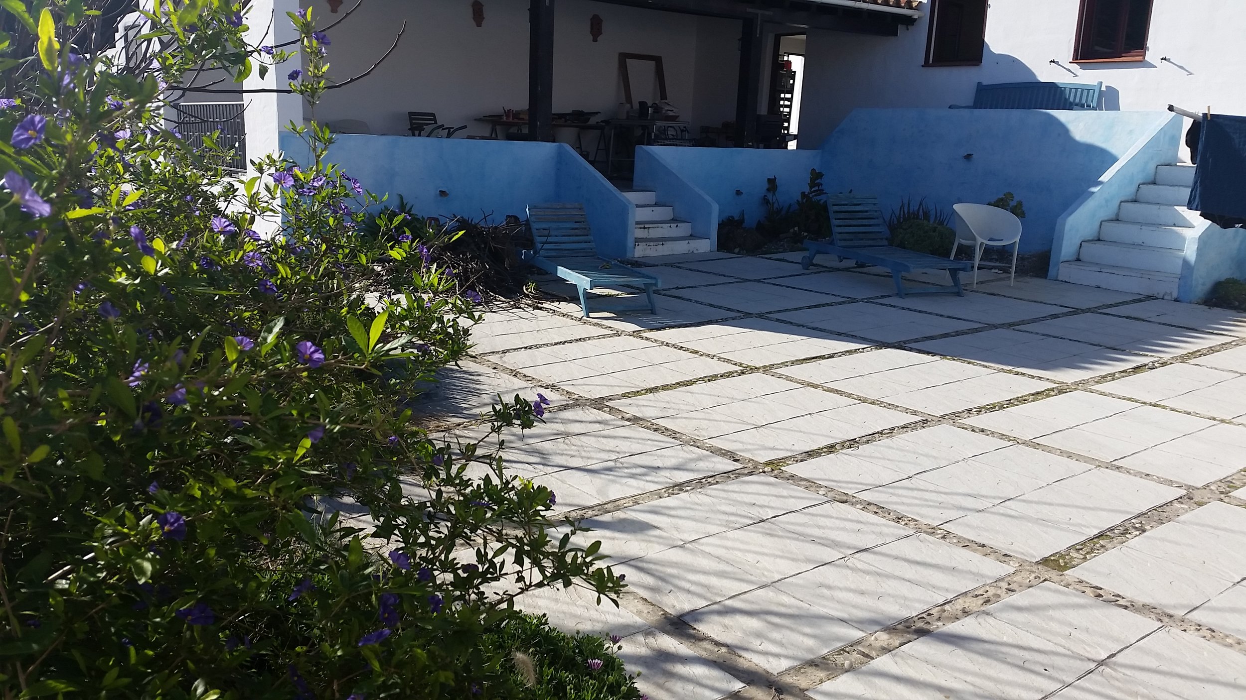 The courtyard and covered porch next to the casita